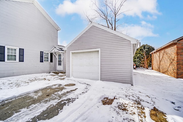 view of snow covered garage