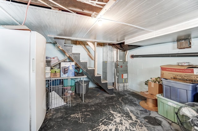 basement with white fridge