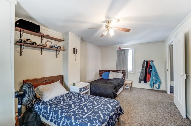 bedroom with carpet floors, crown molding, and ceiling fan