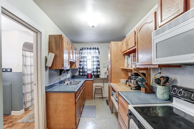 kitchen with sink and electric range