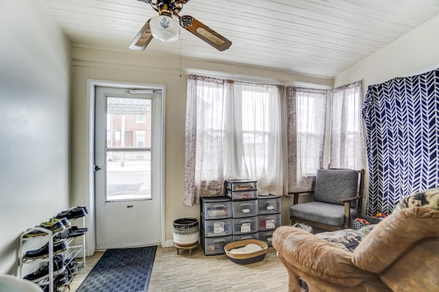 sitting room featuring ceiling fan