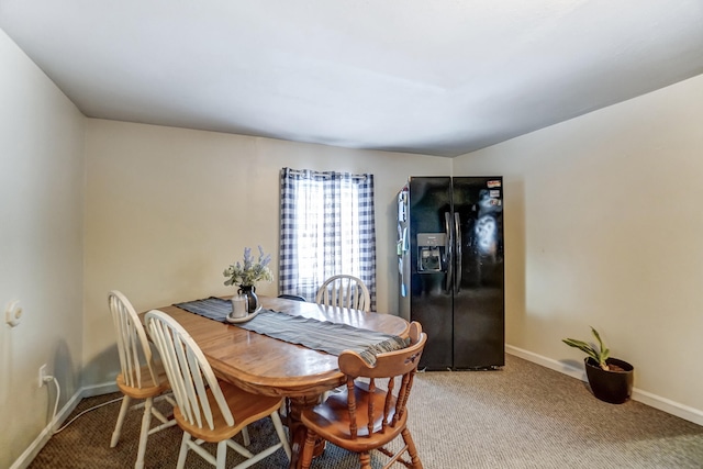 view of carpeted dining area