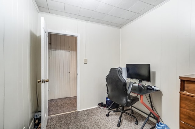 carpeted office space featuring ornamental molding