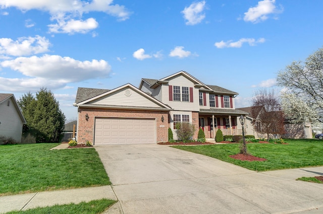 traditional home featuring a garage, driveway, a front lawn, and covered porch