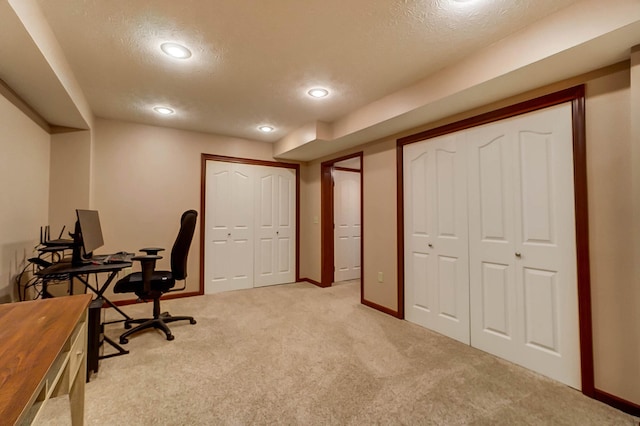 home office with light carpet, recessed lighting, baseboards, and a textured ceiling