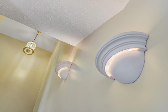 interior details featuring a textured ceiling