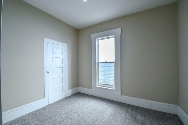 carpeted spare room with a healthy amount of sunlight