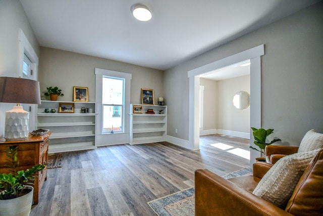 living area with hardwood / wood-style flooring