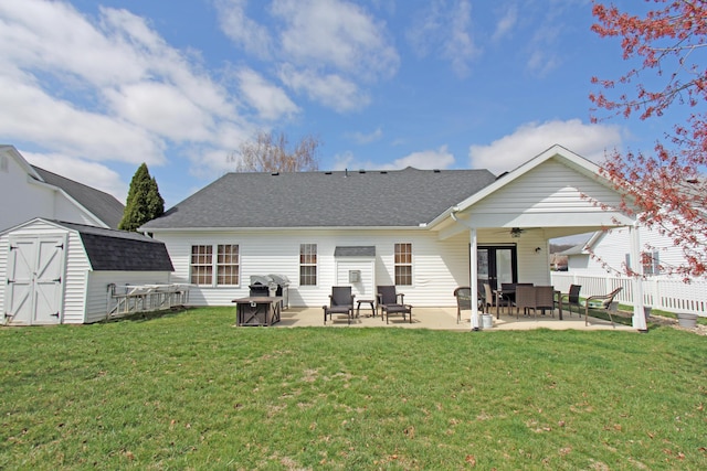 609 Lambert Dr, Piqua, OH 45356 - back of house with an outbuilding, fence, a storage unit, ceiling fan, and a patio area