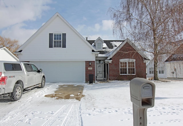 view of front of property featuring brick siding and an attached garage