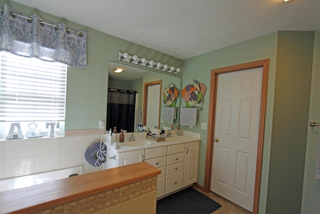 bathroom with double vanity and a sink