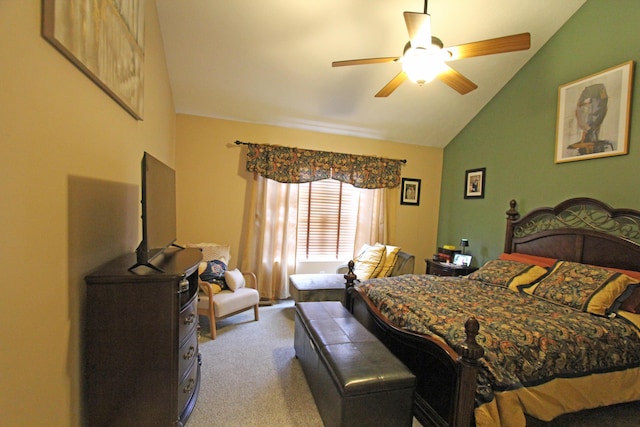 bedroom with light carpet, vaulted ceiling, and a ceiling fan