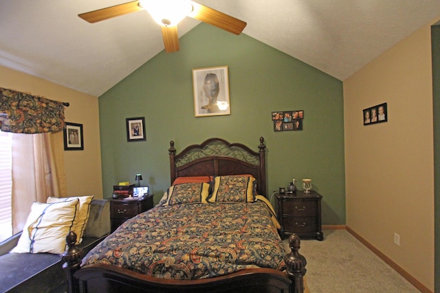 carpeted bedroom featuring vaulted ceiling, a ceiling fan, and baseboards