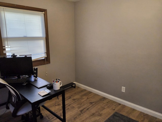 home office with hardwood / wood-style floors