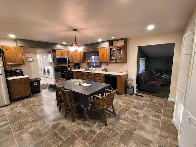 dining area with washing machine and dryer and sink