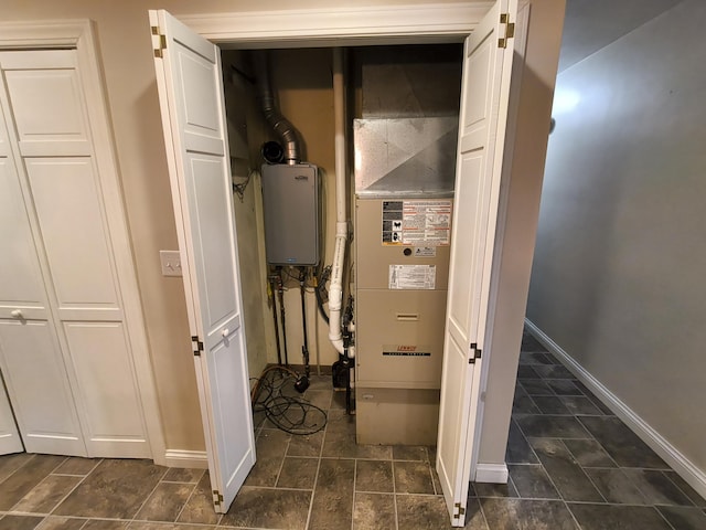 utility room with water heater