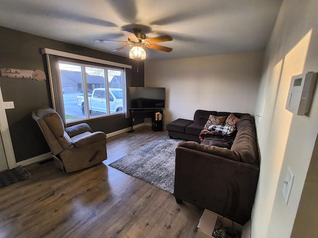 living room with hardwood / wood-style flooring and ceiling fan