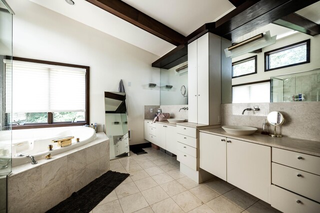 125 Hawthorne Rd, Springfield, OH 45504 - full bathroom with a bath, two vanities, tile patterned floors, a shower stall, and tasteful backsplash
