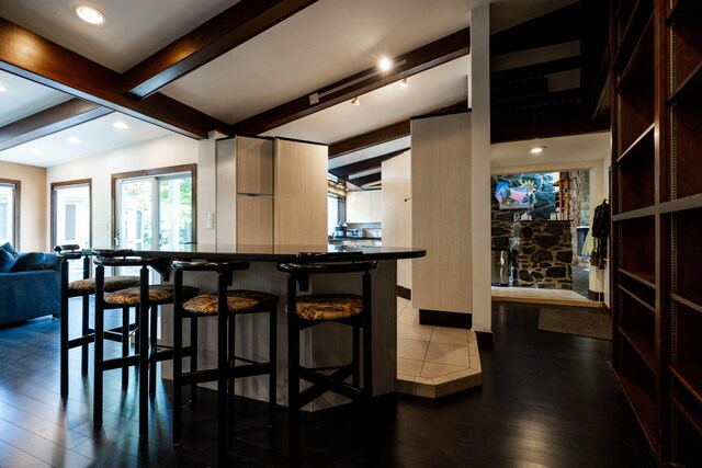 125 Hawthorne Rd, Springfield, OH 45504 - kitchen featuring dark wood-style floors, a breakfast bar, tile countertops, recessed lighting, and modern cabinets