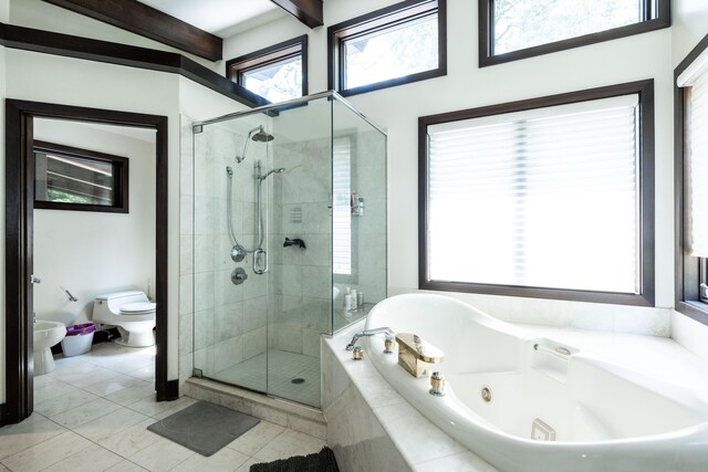 125 Hawthorne Rd, Springfield, OH 45504 - bathroom featuring a shower stall, a jetted tub, a bidet, tile patterned flooring, and healthy amount of natural light