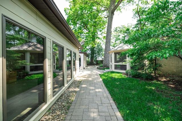 125 Hawthorne Rd, Springfield, OH 45504 - view of yard featuring a sunroom