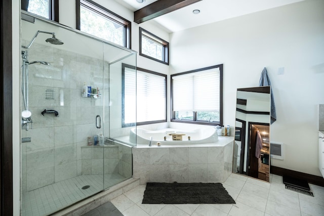 125 Hawthorne Rd, Springfield, OH 45504 - full bathroom with a tub with jets, a stall shower, tile patterned floors, beam ceiling, and heating unit