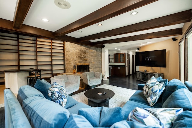 125 Hawthorne Rd, Springfield, OH 45504 - living area with wood finished floors, beam ceiling, a stone fireplace, and recessed lighting