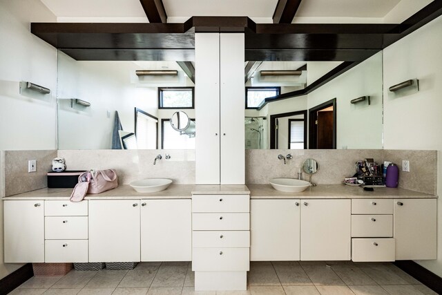 125 Hawthorne Rd, Springfield, OH 45504 - bathroom featuring decorative backsplash, vanity, and tile patterned floors