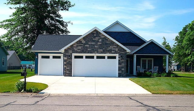 255 N Pine St, Lakeview, OH 43331 - craftsman inspired home with an attached garage, driveway, and stone siding