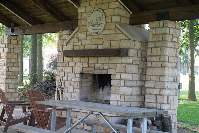 255 N Pine St, Lakeview, OH 43331 - view of patio / terrace with an outdoor stone fireplace