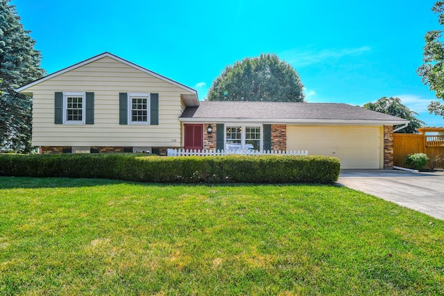 1138 Edgebrook Ave, New Carlisle, OH 45344 - tri-level home with concrete driveway, an attached garage, and brick siding