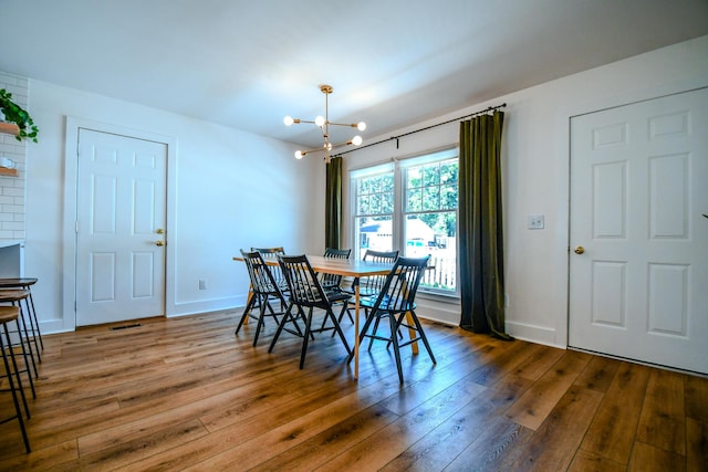 1138 Edgebrook Ave, New Carlisle, OH 45344 - dining area featuring a chandelier and hardwood / wood-style floors