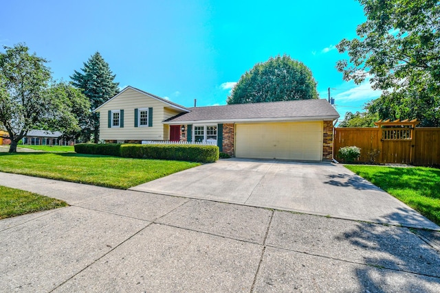 1138 Edgebrook Ave, New Carlisle, OH 45344 - split level home featuring concrete driveway, a garage, and brick siding
