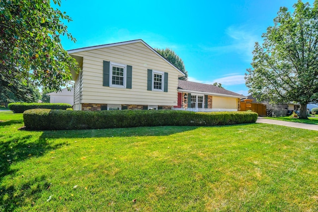 1138 Edgebrook Ave, New Carlisle, OH 45344 - tri-level home featuring concrete driveway and a garage