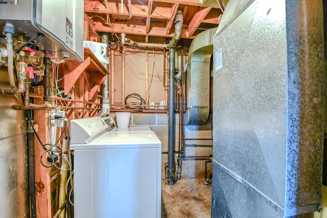 1138 Edgebrook Ave, New Carlisle, OH 45344 - washroom with heating unit and washing machine and dryer