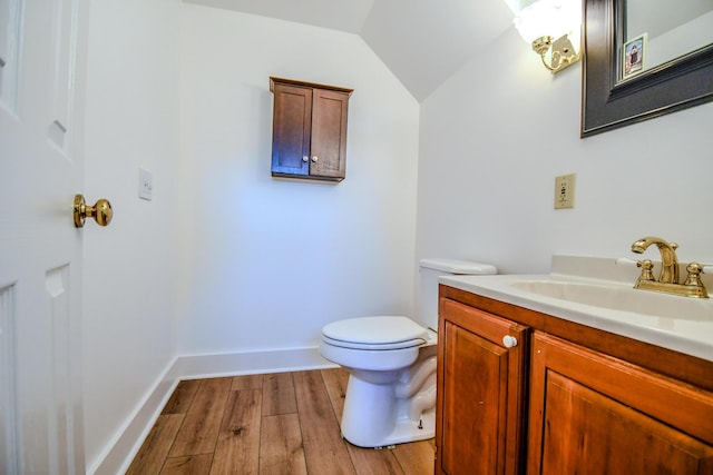 1138 Edgebrook Ave, New Carlisle, OH 45344 - half bath with vanity, wood finished floors, and lofted ceiling