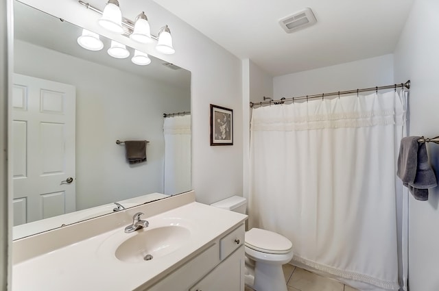 bathroom featuring toilet, tile patterned flooring, visible vents, and vanity