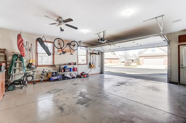 garage with baseboards and a garage door opener