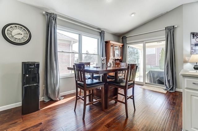 dining area with lofted ceiling, dark wood-style floors, and baseboards