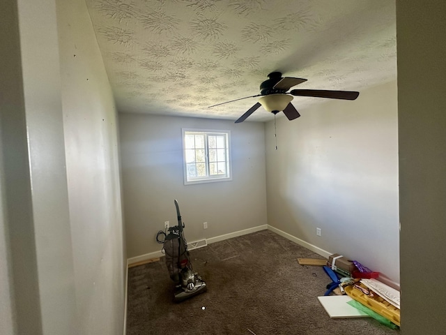 unfurnished room featuring carpet flooring, a textured ceiling, a ceiling fan, and baseboards