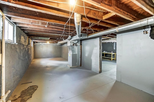 basement featuring heating unit