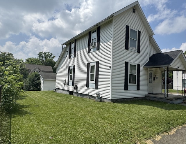 229 N Elm St, Bellefontaine, OH 43311 - view of property exterior featuring a lawn and covered porch