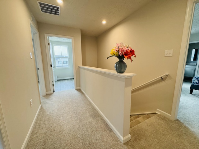 1556 Knights Way, Sidney, OH 45365 - hallway featuring an upstairs landing, baseboards, carpet, and visible vents