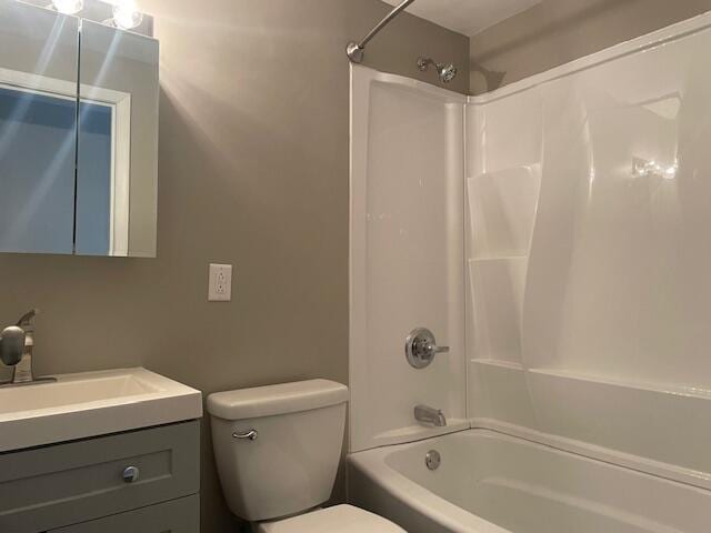 full bathroom with bathtub / shower combination, toilet, and vanity