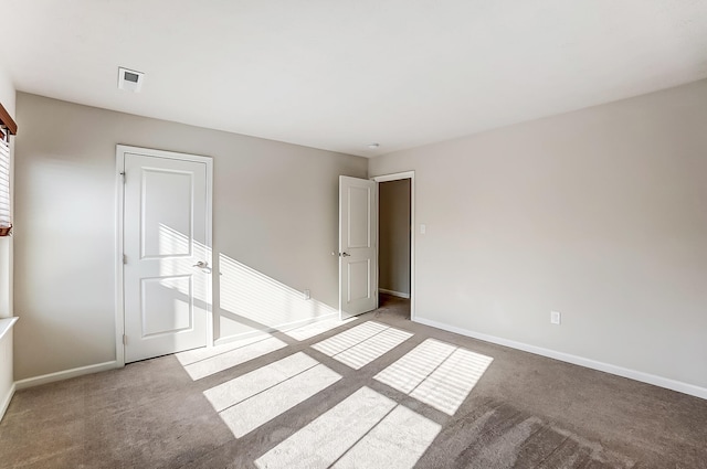 unfurnished room with carpet floors