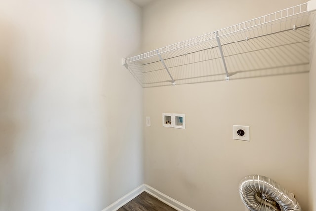 laundry room featuring hookup for a washing machine, dark hardwood / wood-style floors, and hookup for an electric dryer