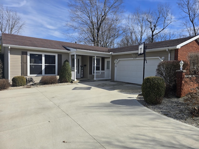 single story home with driveway, an attached garage, and a porch