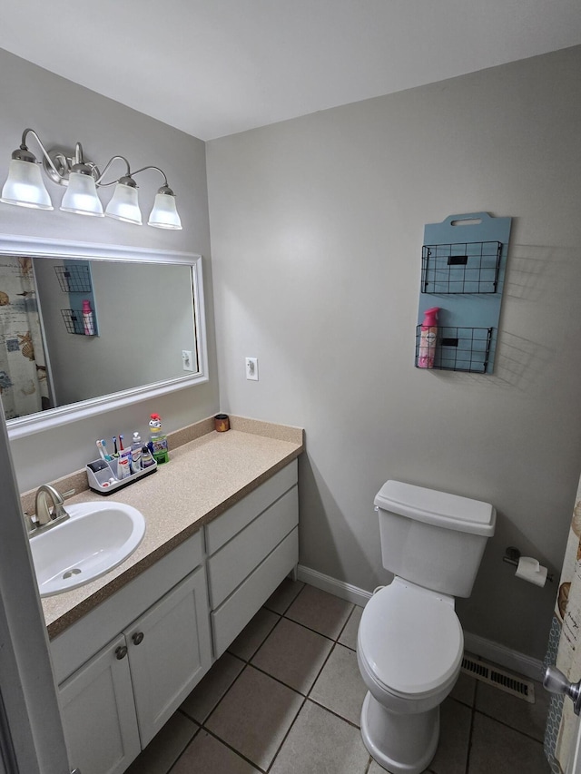 full bath with baseboards, visible vents, toilet, tile patterned floors, and vanity