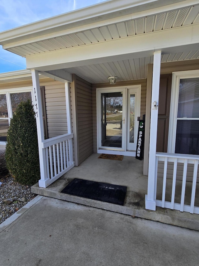 property entrance featuring covered porch