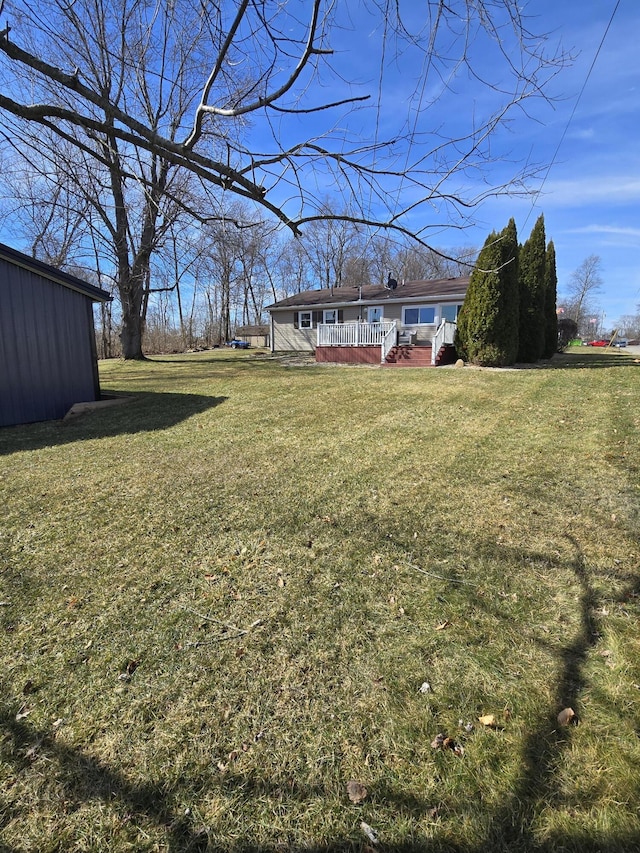 view of yard with a deck